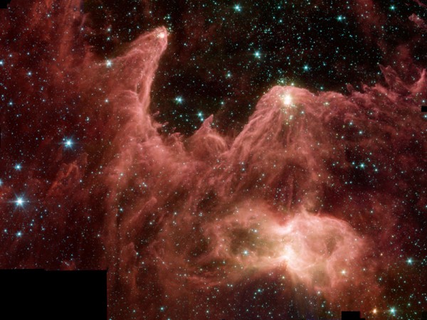 "Mountains of Creation" by Spitzer. These towering pillars of cool gas and dust are illuminated at their tips with light from warm, embryonic stars.  The pillars in the Spitzer image are part of a region called W5, in the Cassiopeia constellation 7,000 light-years away and 50 light-years across. In the image, hundreds of forming stars (white/yellow) can seen for the first time inside the central pillar, and dozens inside the tall pillar to the left.